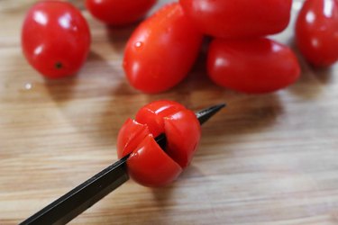 Slice grape tomatoes