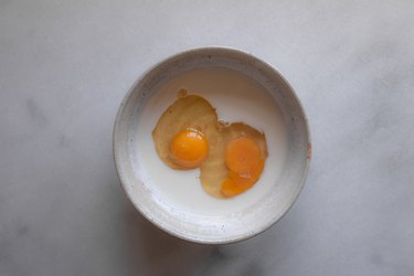 Add the eggs and milk into a small bowl.