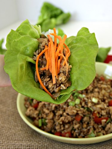 ground turkey in wrap with garnish for healthy turkey lettuce wraps