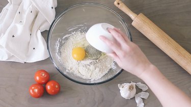 Adding ingredients to bowl