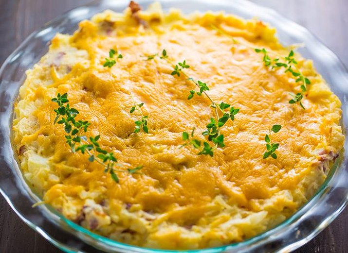 Cheese potato pie with fresh herb garnish