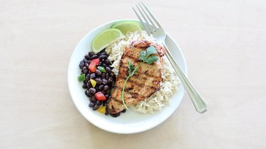 Lime cilantro chicken plated with black beans and rice