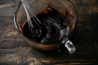 Whisk the brownie batter until it is very smooth, thick and glossy.