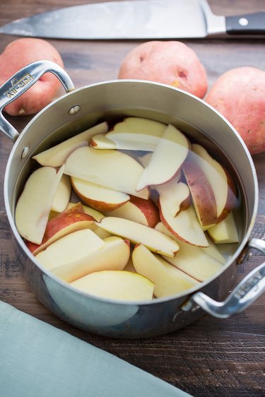 Soak the potato wedges in a large bowl of water