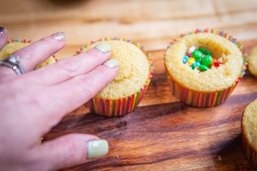 Placing cake plug top over candy