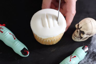 Cutting four slits in fondant