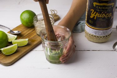 Muddling lime and sugar