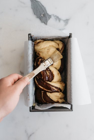 Coat the babka with a thin layer of egg wash.