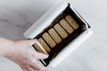 Press the shortbread biscuits into the caramel in an even layer.