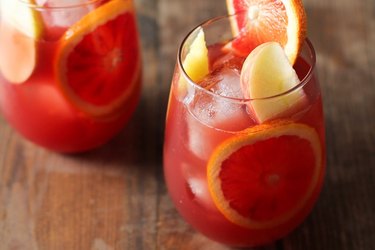 Two glasses of pomegranate citrus sangria.