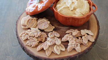 Serving pumpkin spice dip and pie crust cookies