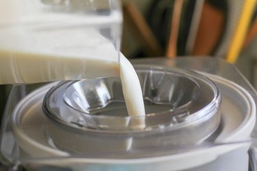 Pouring ice cream base into ice cream maker