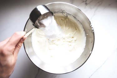 Pour in the sugar then whisk to combine before adding in the vanilla and cinnamon.