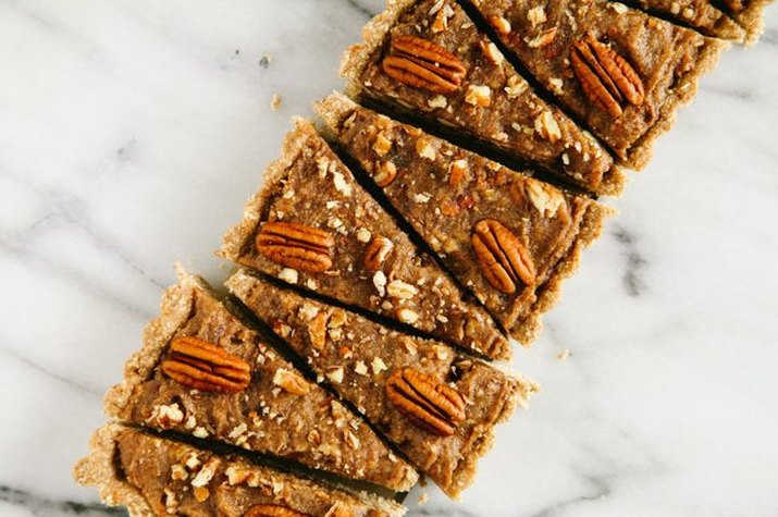 Triangular slices of no-bake pecan pie topped with pecans.