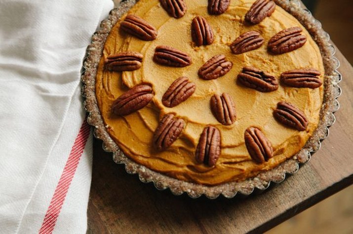 Creamy no-bake pumpkin pie topped with pecans.