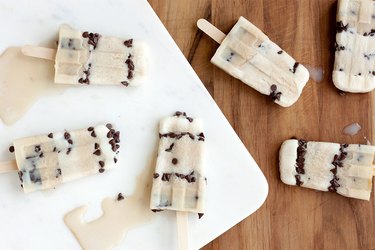 Chocolate chip ice pop on wood and marble