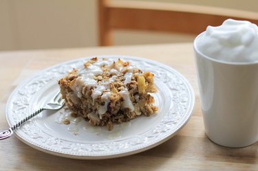 A powdered sugar glaze completes apple walnut baked oatmeal.