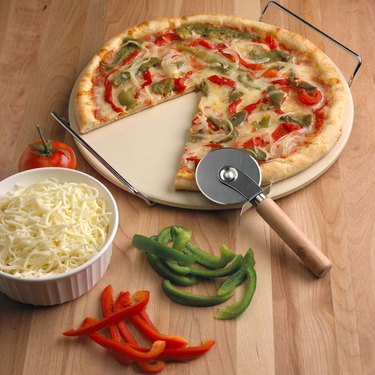 pizza stone with pizza cutter