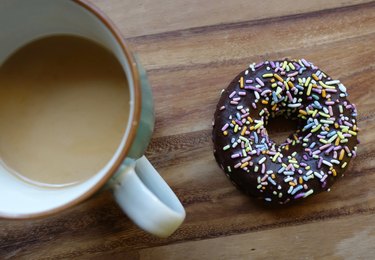 Healthy coconut flour low carb chocolate covered donut with sprinkles.