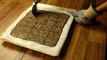 Scoring healthy seed and nut crispbread crackers.