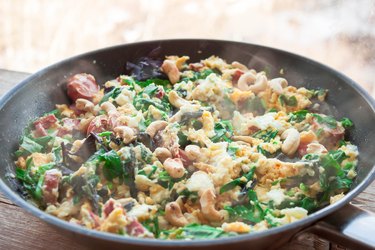 Frittata with spinach, sausages and cashew nuts