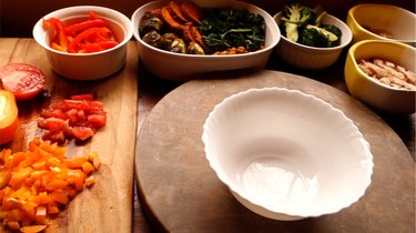 Ingredients and empty bowl in preparation for making a Buddha bowl.