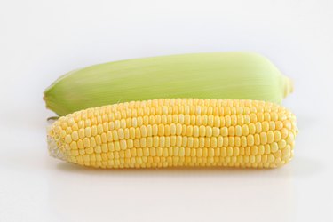 Closeup of corn next to husk