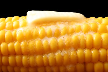 Butter slice melting on hot corn