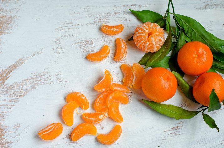 Ripe tangerines on white background