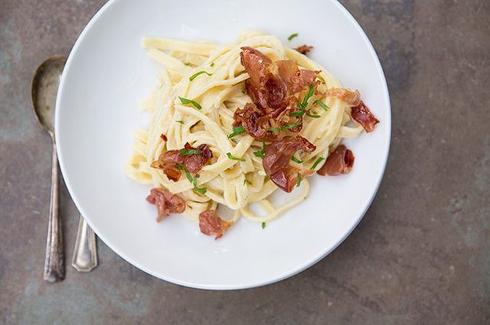 Prosciutto carbonara pasta with fresh herbs