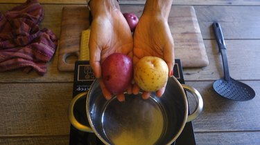 Preparing raw potatoes for freezing.