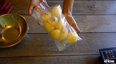 Freezing par-cooked potatoes in a freezer bag.