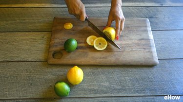 Preparing citrus slices for freezing.