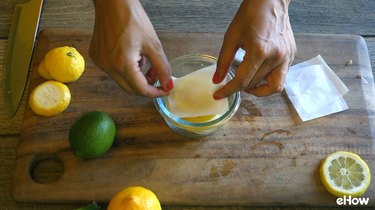 Preparing citrus slices for freezing.