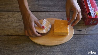 Preparing cheese for freezing.