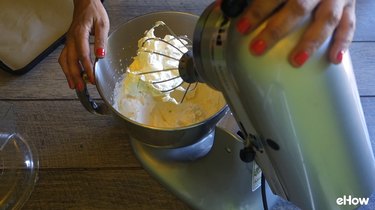 Whipped cream in standing blender.