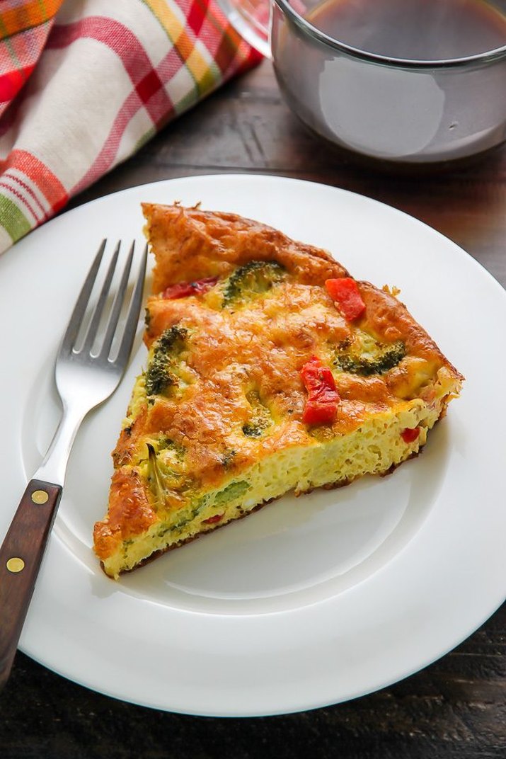 A slice of spongy broccoli cheddar frittata.