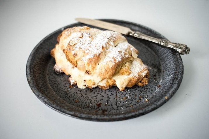 Plate with almond croissant.